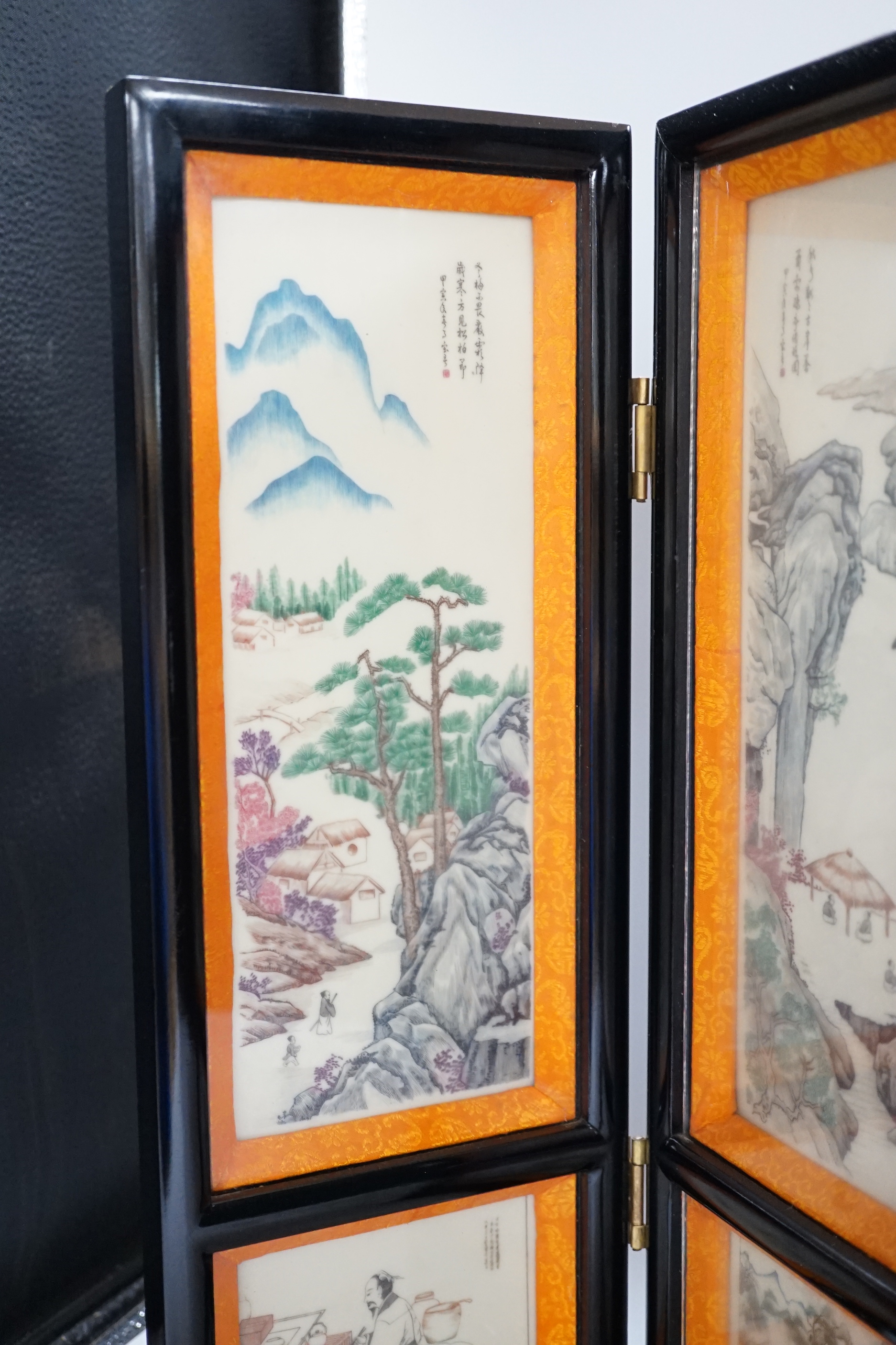 A 20th century Chinese resin three fold screen, 46cm tall